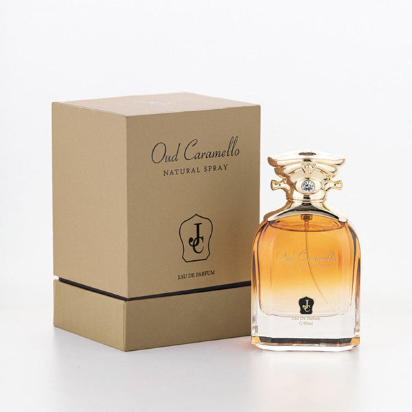 Oud Caramello natural spray perfume bottle and packaging on a white background
